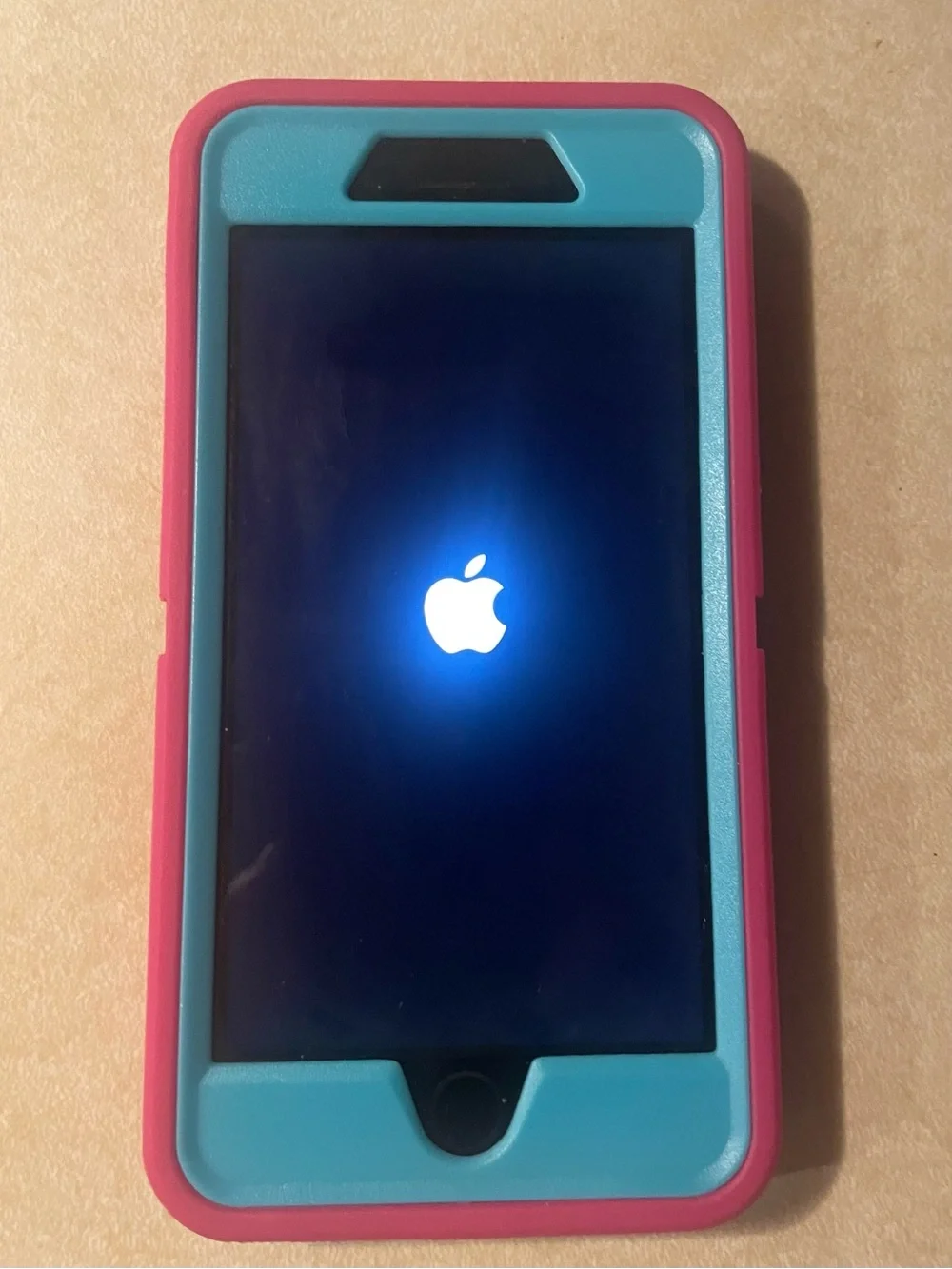 Apple IPhone 7 Plus with Pink and Teal Protective Phone Case with Front Frame.